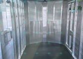 Inside an empty aluminum cargo trailer with ribbed ceiling and smooth metal walls ready for loading