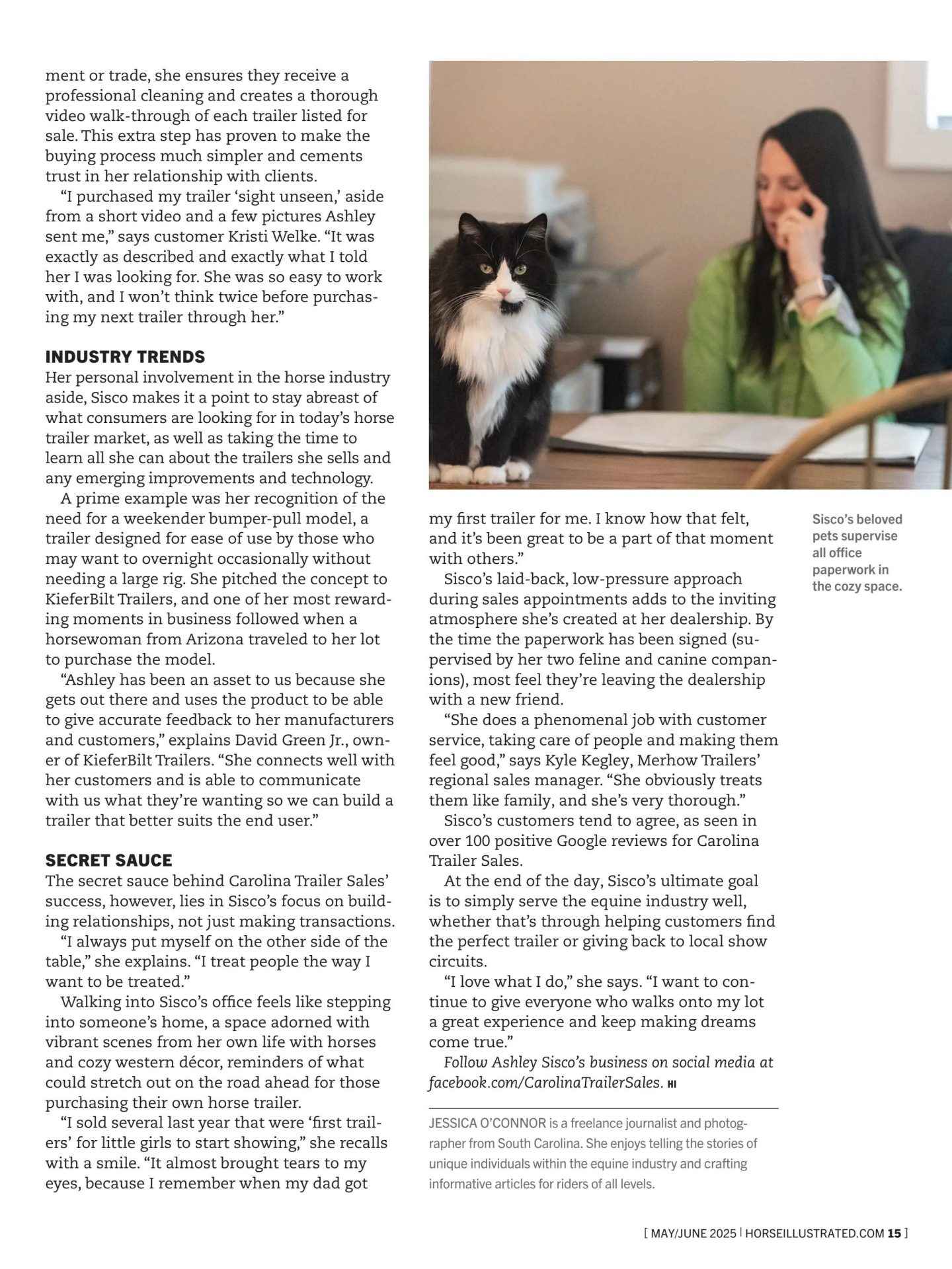 Cat sits on a wooden desk beside a woman talking on a phone in a bright office, with columns of article text to the left and a caption area to the bottom right.